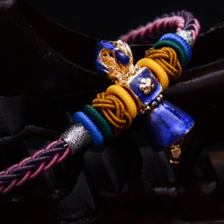 Pulsera tibetana hecha a mano Dorje Vajra fuerza ocho hilos cuerda