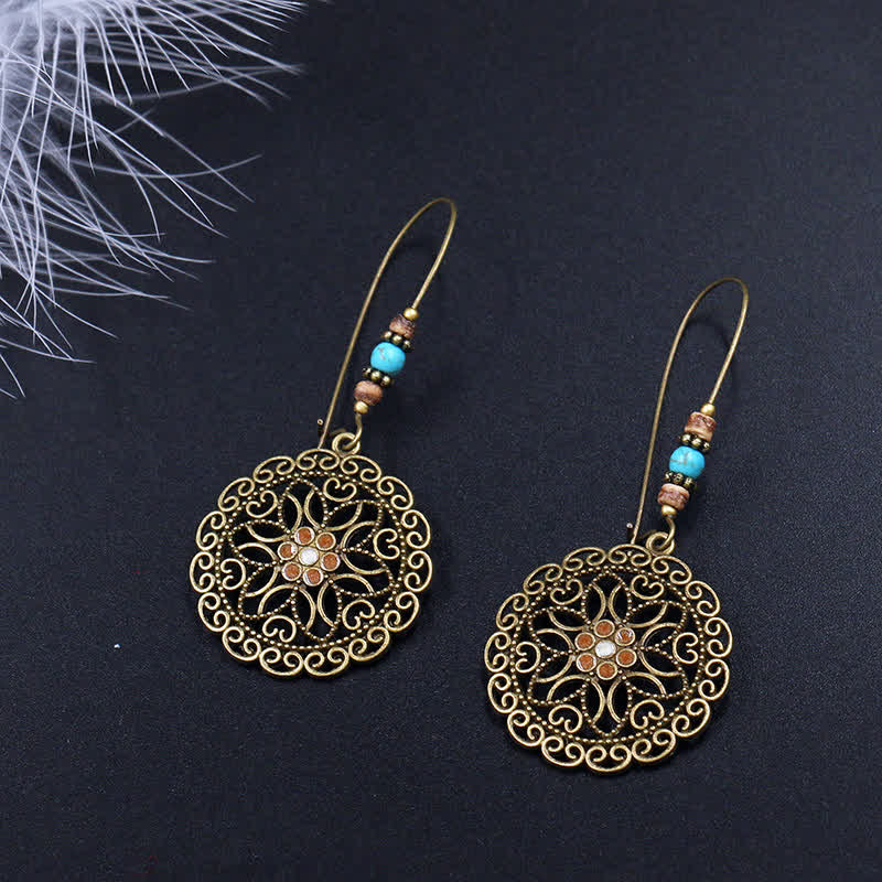 Pendientes colgantes redondos de la suerte con diseño de flores