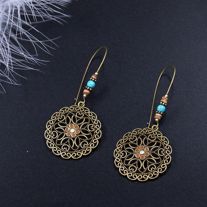 Pendientes colgantes redondos de la suerte con diseño de flores
