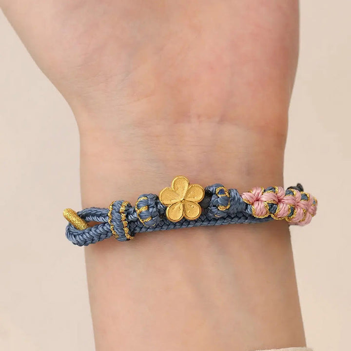 Pulsera de hilo de riqueza con diseño de flor de durazno