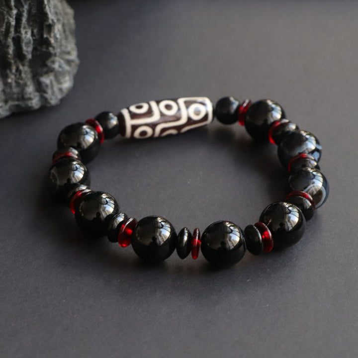 Pulsera de protección de la riqueza con cuentas Dzi de nueve ojos de ónix negro y Buddha Stones