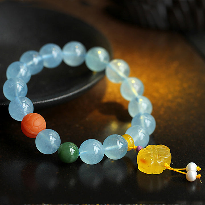 Pulsera de la paz con dije anudado chino, ámbar, aguamarina natural