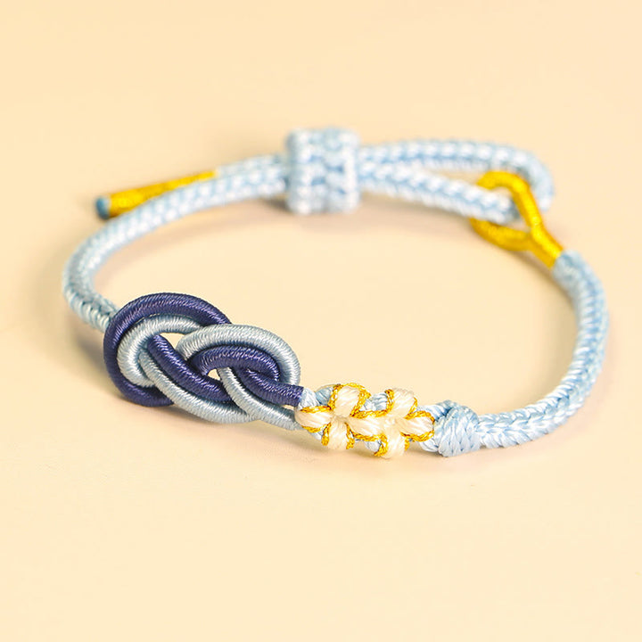 Pulsera de conexión de suerte con nudo de flor de melocotón, nudo de paz de ocho hilos hecho a mano con Buddha Stones