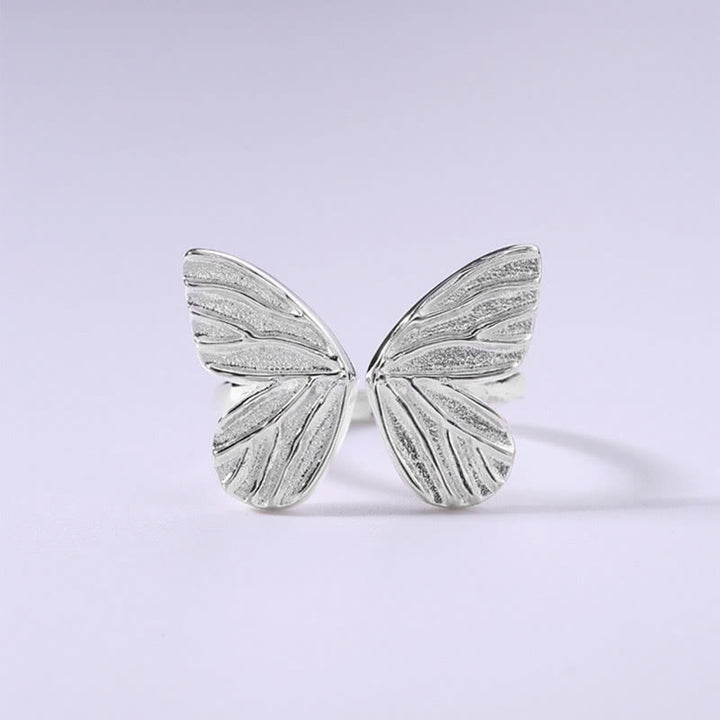 Anillo de libertad de amor con mariposa de plata de ley 925 con Buddha Stones