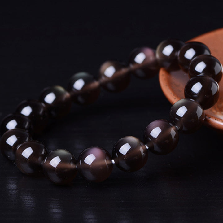 Pulsera positiva de obsidiana arcoíris natural con Buddha Stones