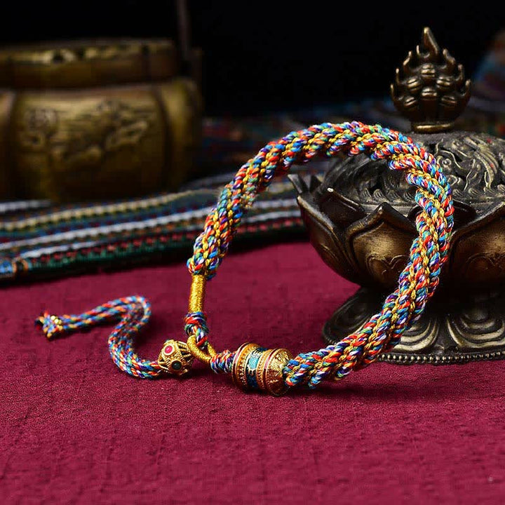 Pulsera de cuerda tejida con dije de rueda de oración Thangka de la suerte hecha a mano tibetana con Buddha Stones