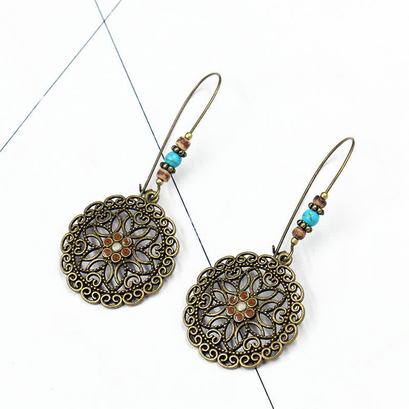 Pendientes colgantes redondos de la suerte con diseño de flores