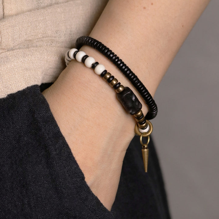 Pulsera de pareja con Buddha Stones, cuentas de hueso, madera de ébano y cobre.