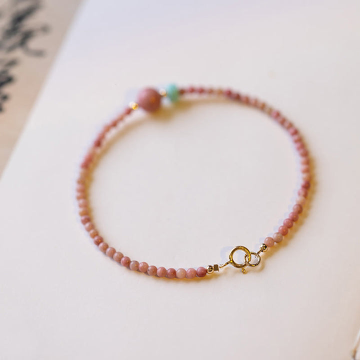 Pulsera de cadena de energía amorosa de rodonita natural chapada en oro de 14 quilates con Buddha Stones