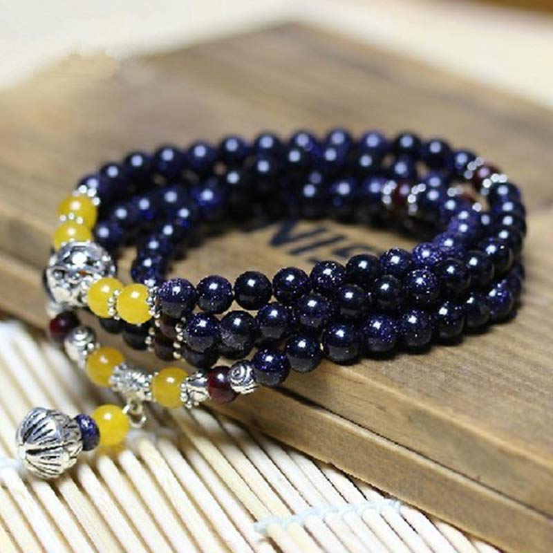 Pulsera con dijes de riqueza de arenisca azul con Buddha Stones Mala