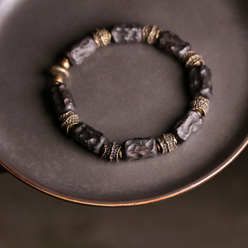 Pulsera de paz tranquila de cobre y madera de ébano tibetano con Buddha Stones