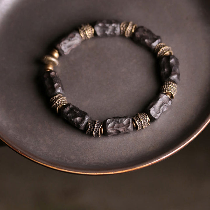 Pulsera de paz tranquila de cobre y madera de ébano tibetano con Buddha Stones