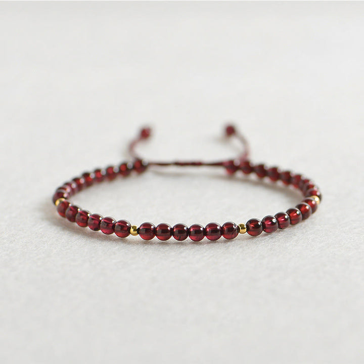 Pulsera de estabilidad con cuentas doradas y granate natural con Buddha Stones