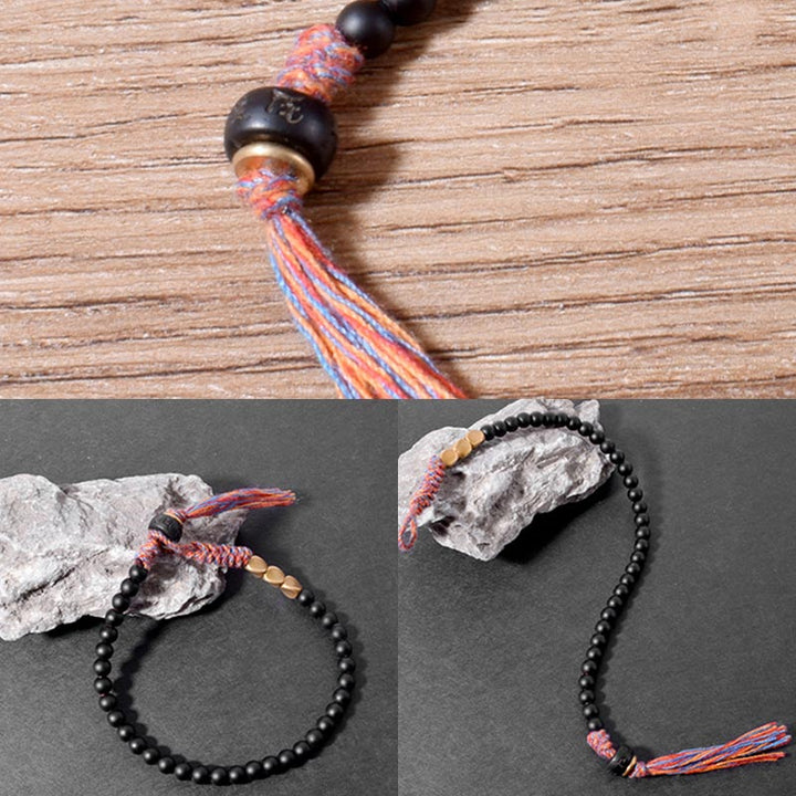 Pulsera con borlas de ónix negro tibetano hecha a mano con Buddha Stones