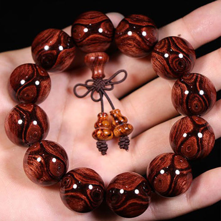 Pulsera cálida de palisandro tibetano con Buddha Stones (tipo aleatorio)