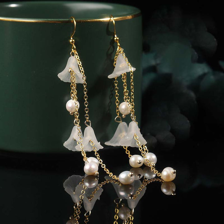 Pendientes colgantes de la suerte con pétalos de flores y perlas de Buddha Stones