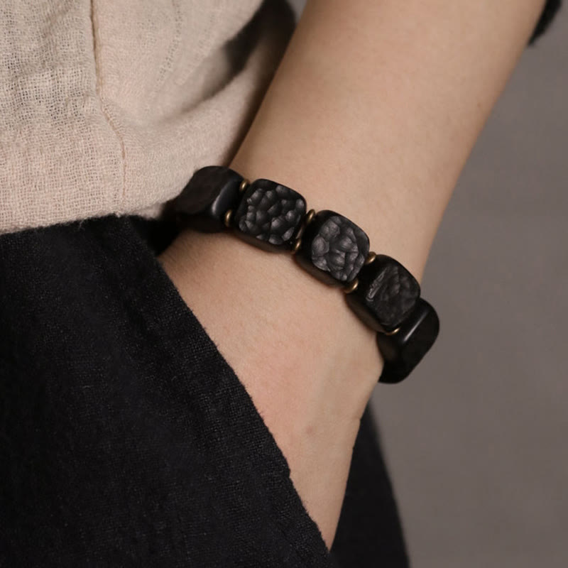 Pulsera de equilibrio de paz de cobre estilo textura de madera de ébano retro con Buddha Stones