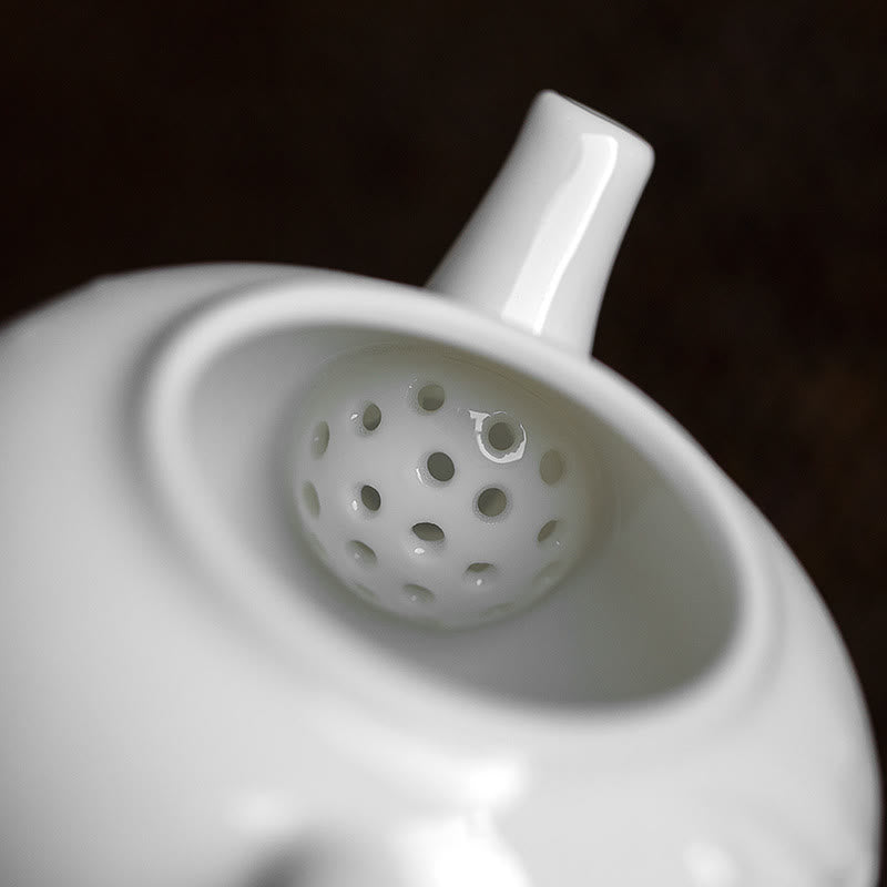Tetera de cerámica con diseño grabado de bambú de pino ciruelo blanco