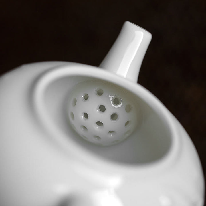 Tetera de cerámica con diseño grabado de bambú de pino ciruelo blanco
