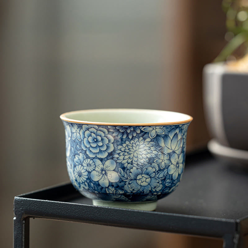 Tazas de té de cerámica de crisantemo con flor de ciruelo y peonía de loto Vintage con Buddha Stones