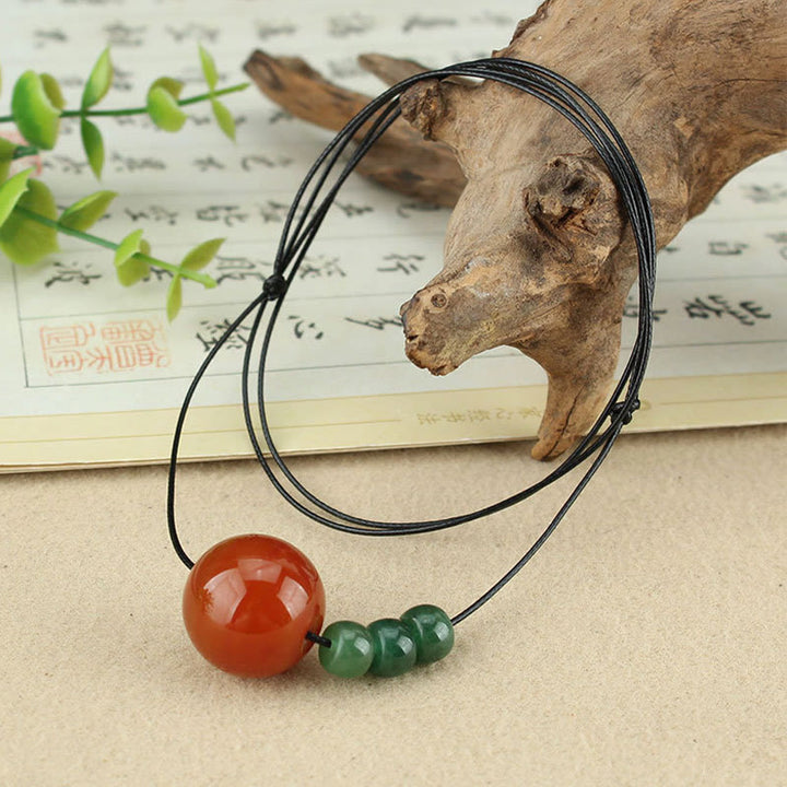 Buddha Stones, ágata roja, Aventurina verde, cuentas de semilla de Bodhi, collar de cuerda de cuero tranquilo, colgante