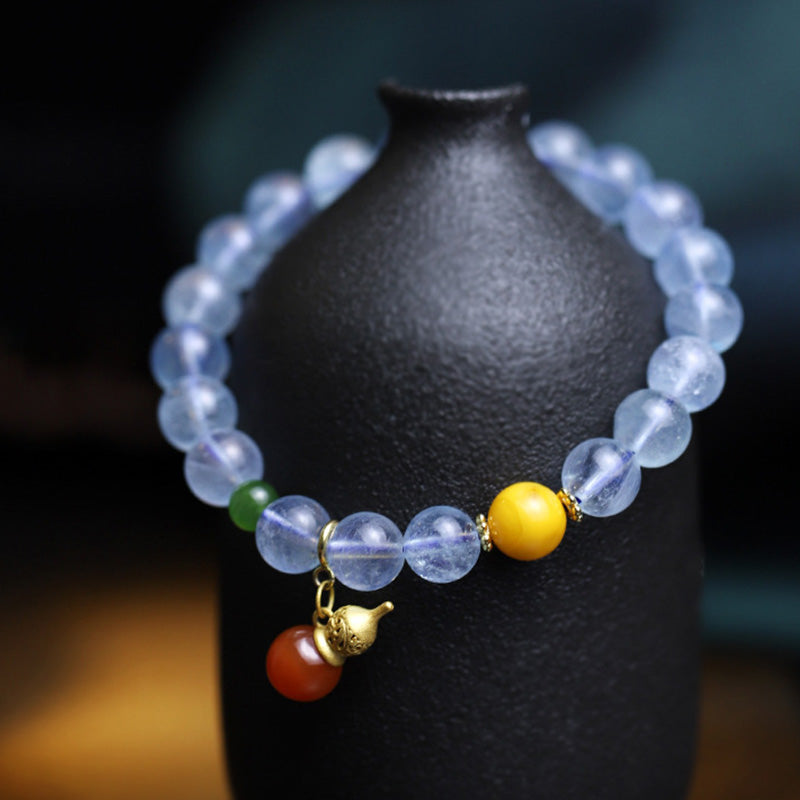 Pulsera con dije de calabaza de la paz con ágata roja y aguamarina