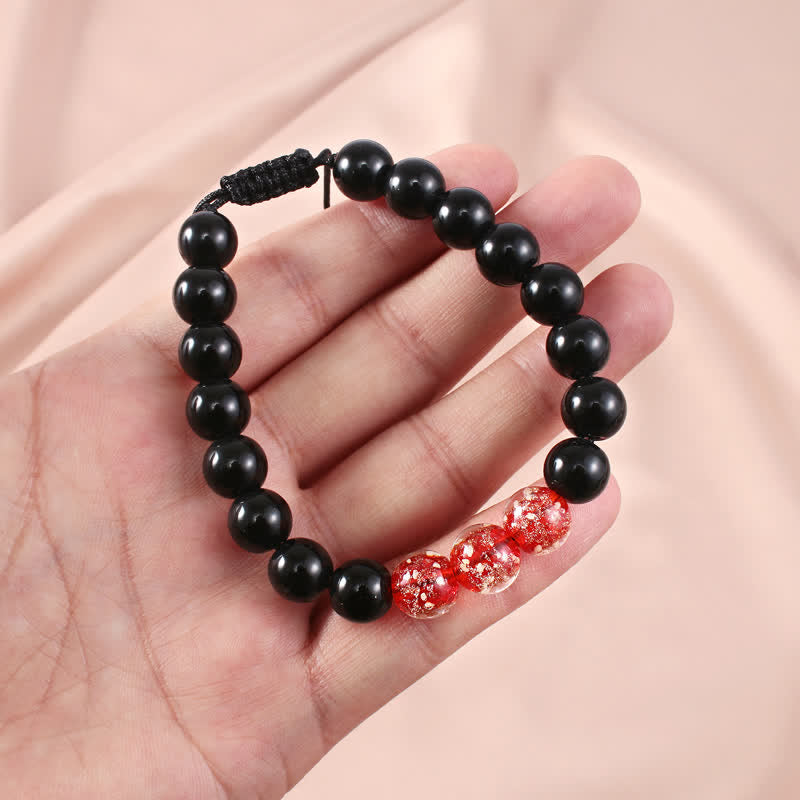 Pulsera de fuerza con piedra luminosa luminosa de obsidiana negra de Buddha Stones
