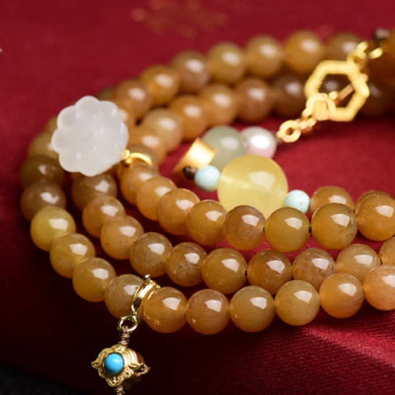 Pulsera de éxito de perlas de jade blanco de loto ámbar de topacio hetiano natural