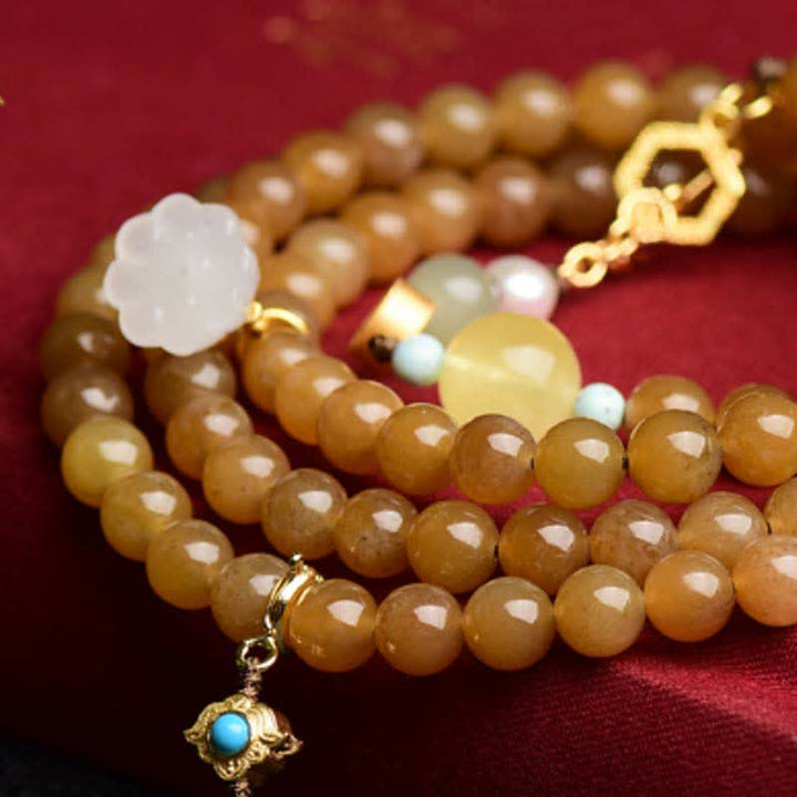 Pulsera de éxito de perlas de jade blanco de loto ámbar de topacio hetiano natural