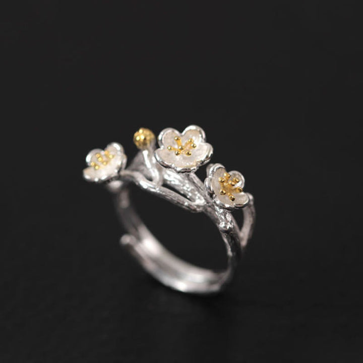 Pendientes de bendición floral de flor de ciruelo de plata de ley 925 con Buddha Stones
