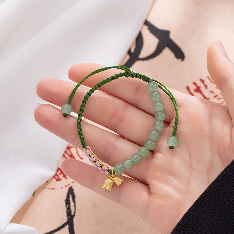 Pulsera trenzada de la suerte con dije de lirio de los valles y cuentas de jade hechas a mano con Buddha Stones