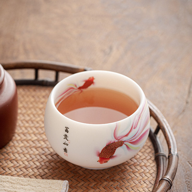 Taza de té de cerámica de porcelana blanca, pez Koi, Buddha Stones, taza de té de Kung Fu