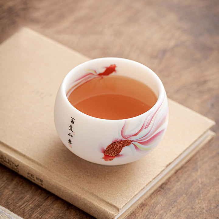 Taza de té de cerámica de porcelana blanca, pez Koi, Buddha Stones, taza de té de Kung Fu