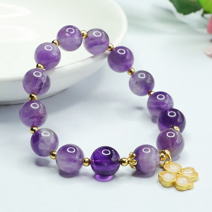 Pulsera con dije de trébol de cuatro hojas y paz interior de cristal de amatista natural con piedras de Buddha Stones