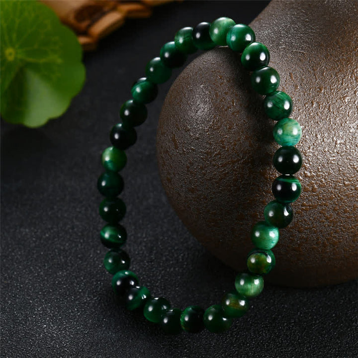 Pulsera de fuerza de ojo de tigre verde natural con Buddha Stones
