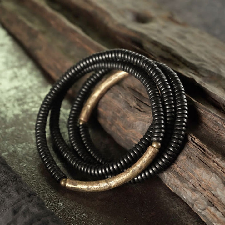 Pulsera multicapa con Buddha Stones, madera de ébano, latón y cobre - image 1