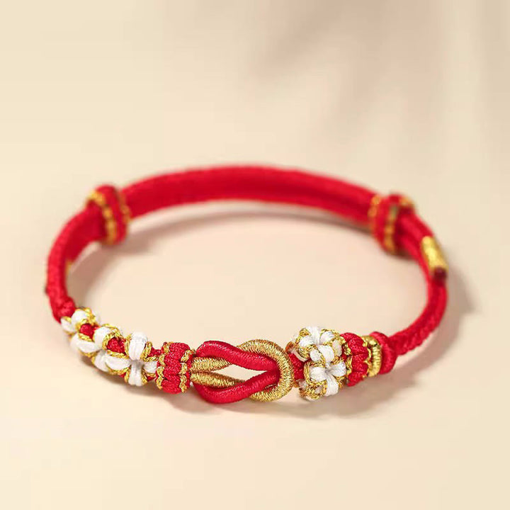 Pulsera de protección de la suerte con nudo de paz de ocho hilos con nudo de flor de melocotón hecho a mano con Buddha Stones