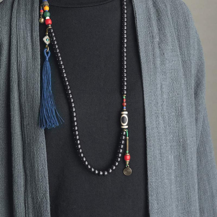 Buddha Stones 108 cuentas Mala madera de ébano cuentas Dzi cobre equilibrio borla pulsera