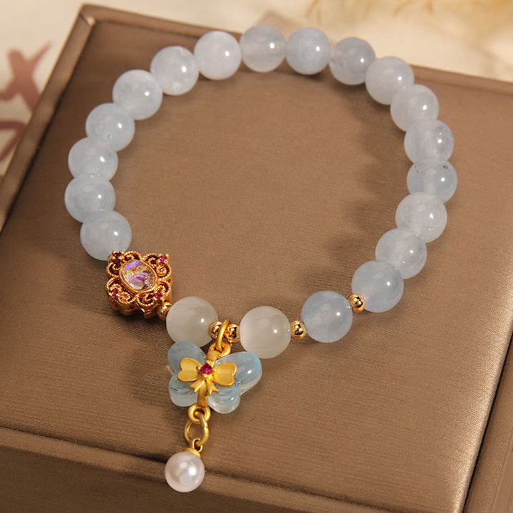 Pulsera con dije de perlas y mariposas curativas con ojo de gato, aguamarina y Buddha Stones