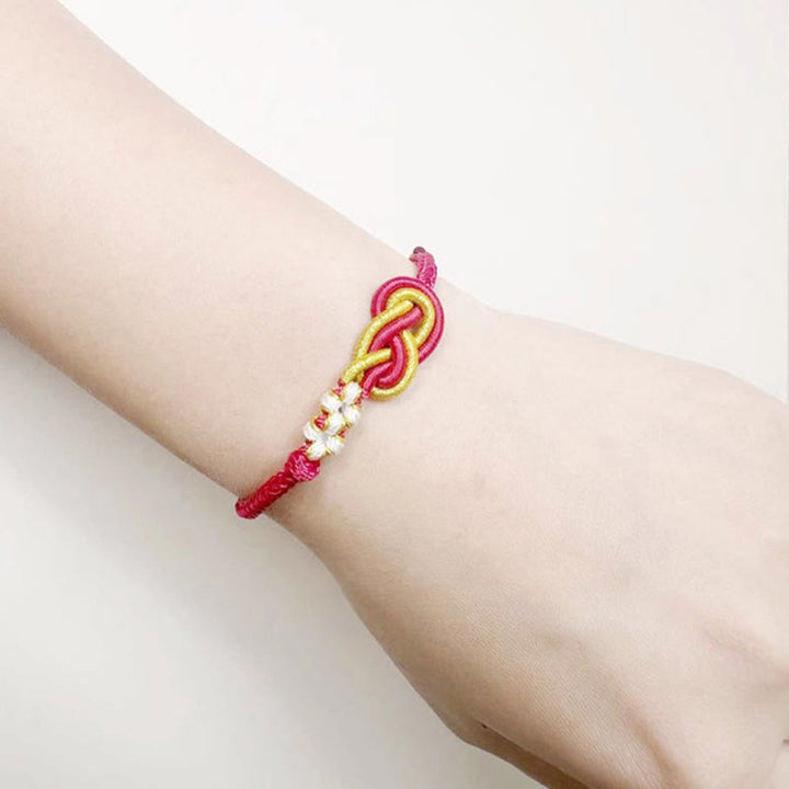 Pulsera de conexión de suerte con nudo de flor de melocotón, nudo de paz de ocho hilos hecho a mano con Buddha Stones
