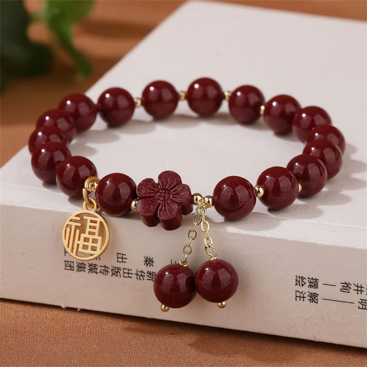 Pulsera de bendición de flor de cerezo con personaje de cinabrio Fu de Buddha Stones