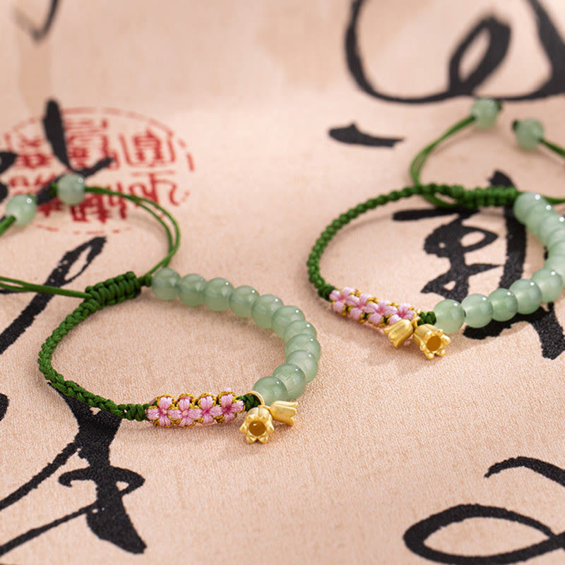 Pulsera trenzada de la suerte con dije de lirio de los valles y cuentas de jade hechas a mano con Buddha Stones