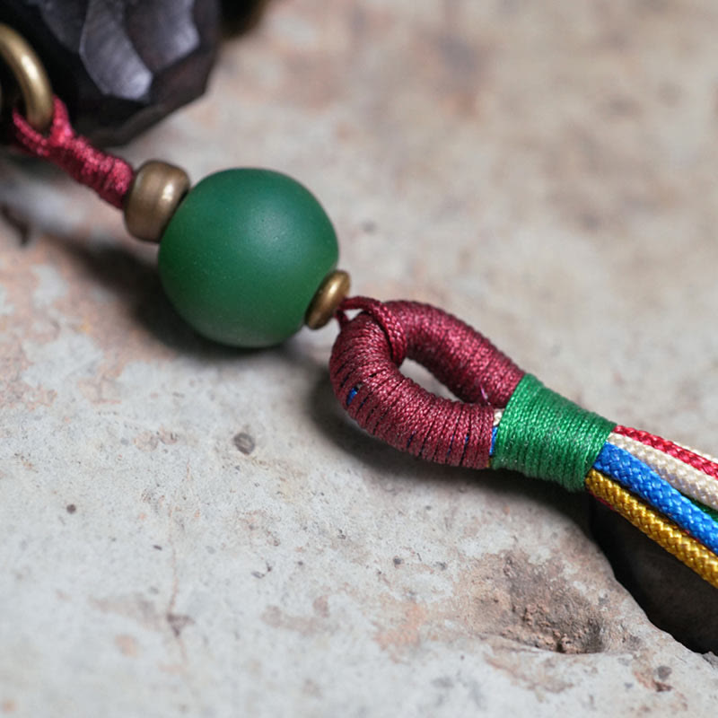 Pulsera Mala de muñeca con borla de paz de cobre y madera de ébano del Tíbet