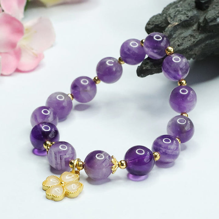 Pulsera con dije de trébol de cuatro hojas y paz interior de cristal de amatista natural con piedras de Buddha Stones