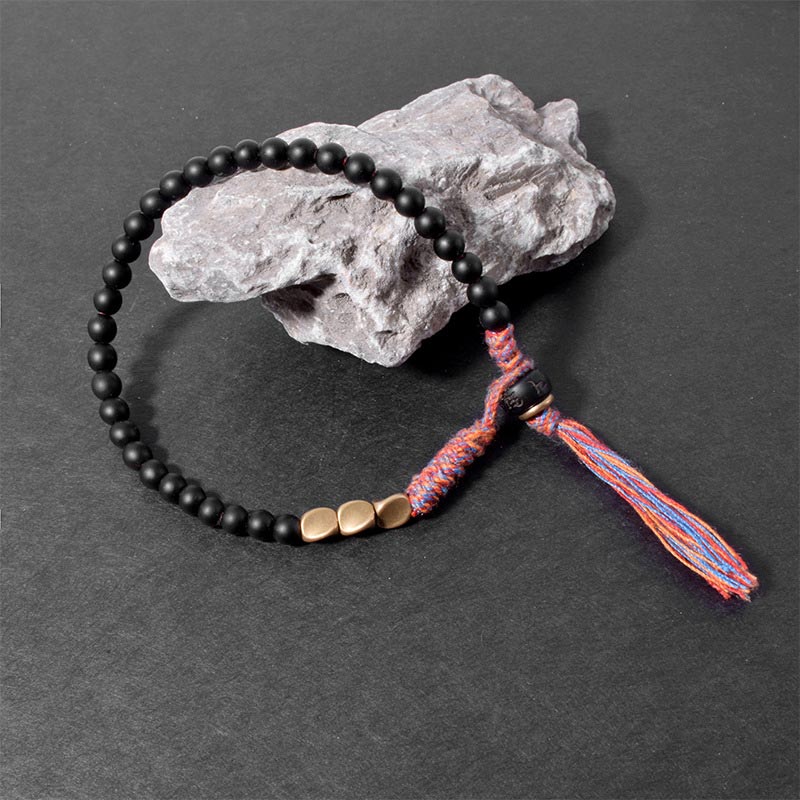 Pulsera con borlas de ónix negro tibetano hecha a mano con Buddha Stones