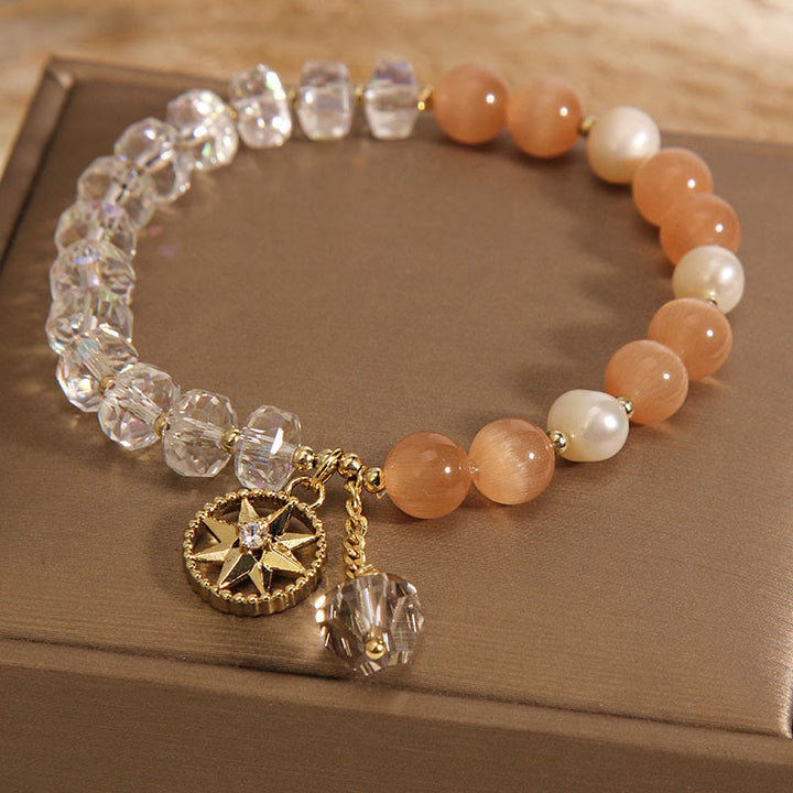 Pulsera de soporte con estrella de cristal blanco y ojo de gato naranja de Buddha Stones