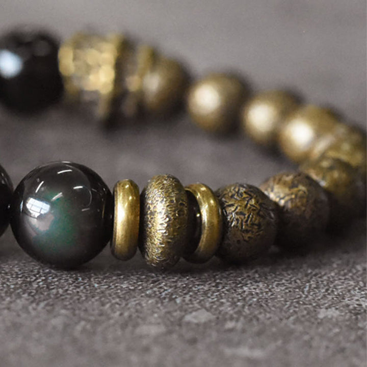 Pulsera de transformación positiva con cuentas de cobre y obsidiana arcoíris de Buddha Stones