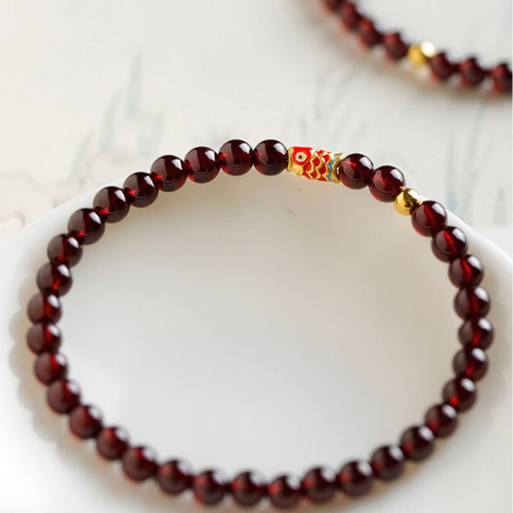 Pulsera de protección con granate natural y pez Koi de oro 999 de Buddha Stones - image 5