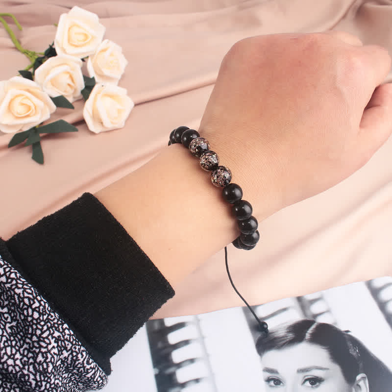 Pulsera de fuerza con piedra luminosa luminosa de obsidiana negra de Buddha Stones