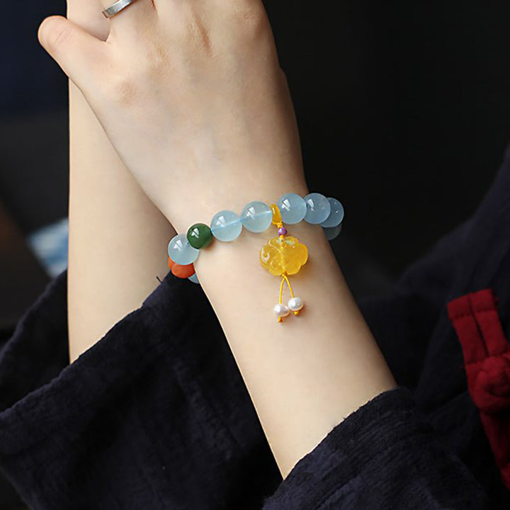 Pulsera de la paz con dije anudado chino, ámbar, aguamarina natural